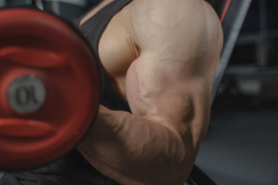 Athlete pushing through final rep at gym, illustrating is training to failure good for muscle growth