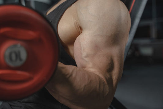 Athlete pushing through final rep at gym, illustrating is training to failure good for muscle growth