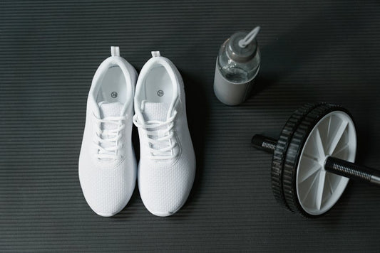 Flat shoes vs running shoes for lifting weights side-by-side comparison showing sole differences for gym performance